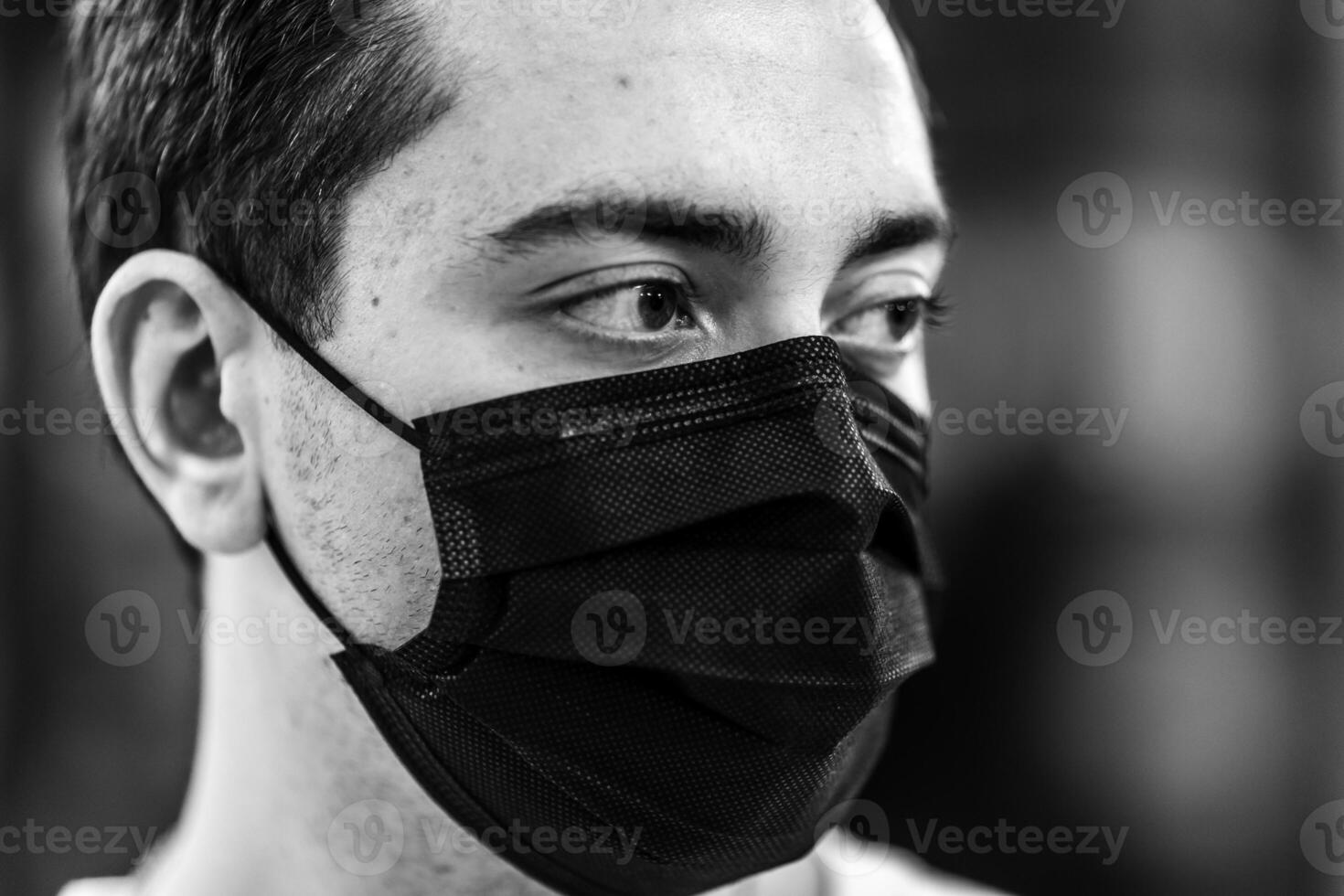 Portrait of a man in a mask from a virus. photo
