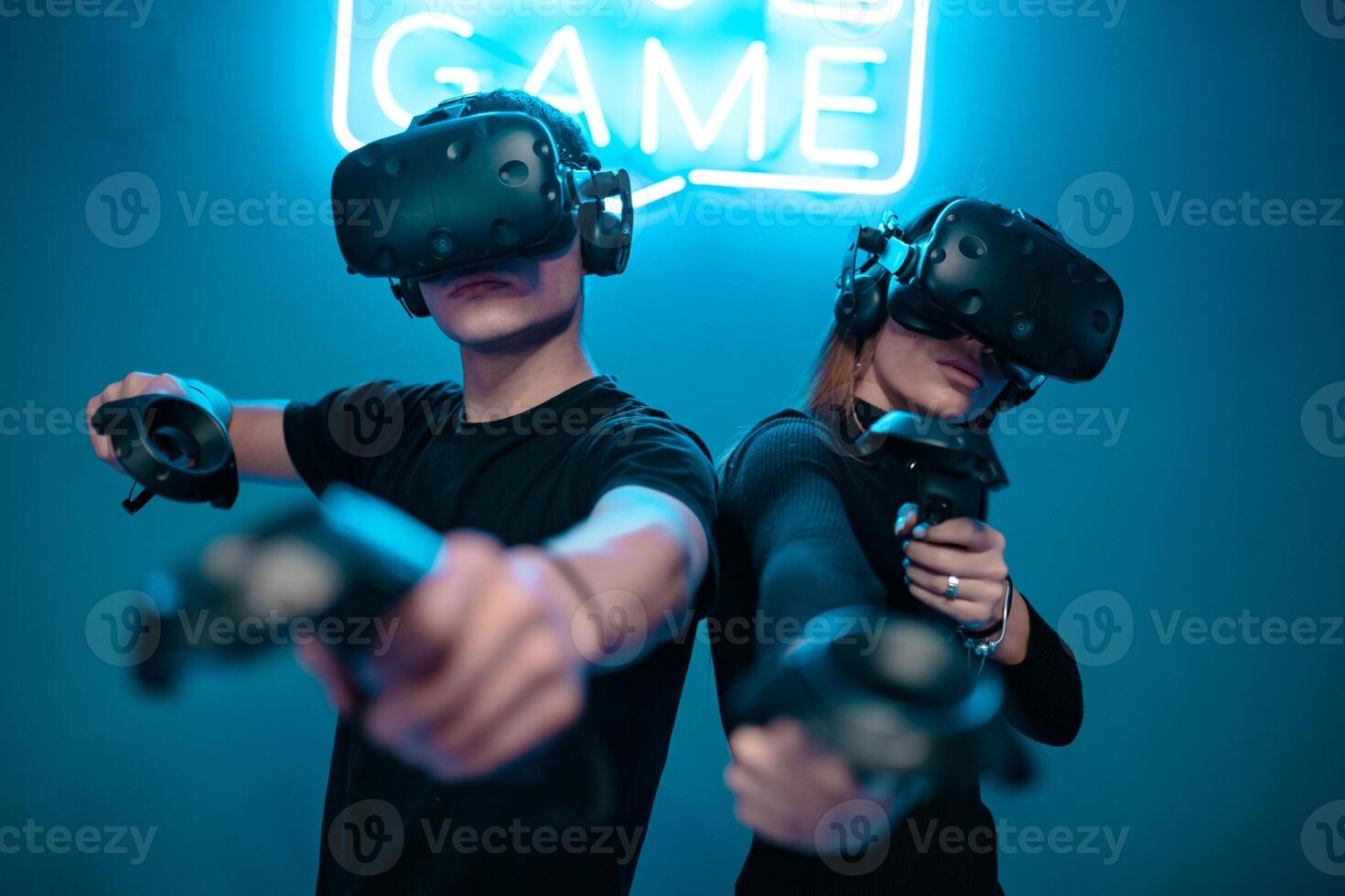 Cyber battle in VR reality. Playing in a neon room. photo