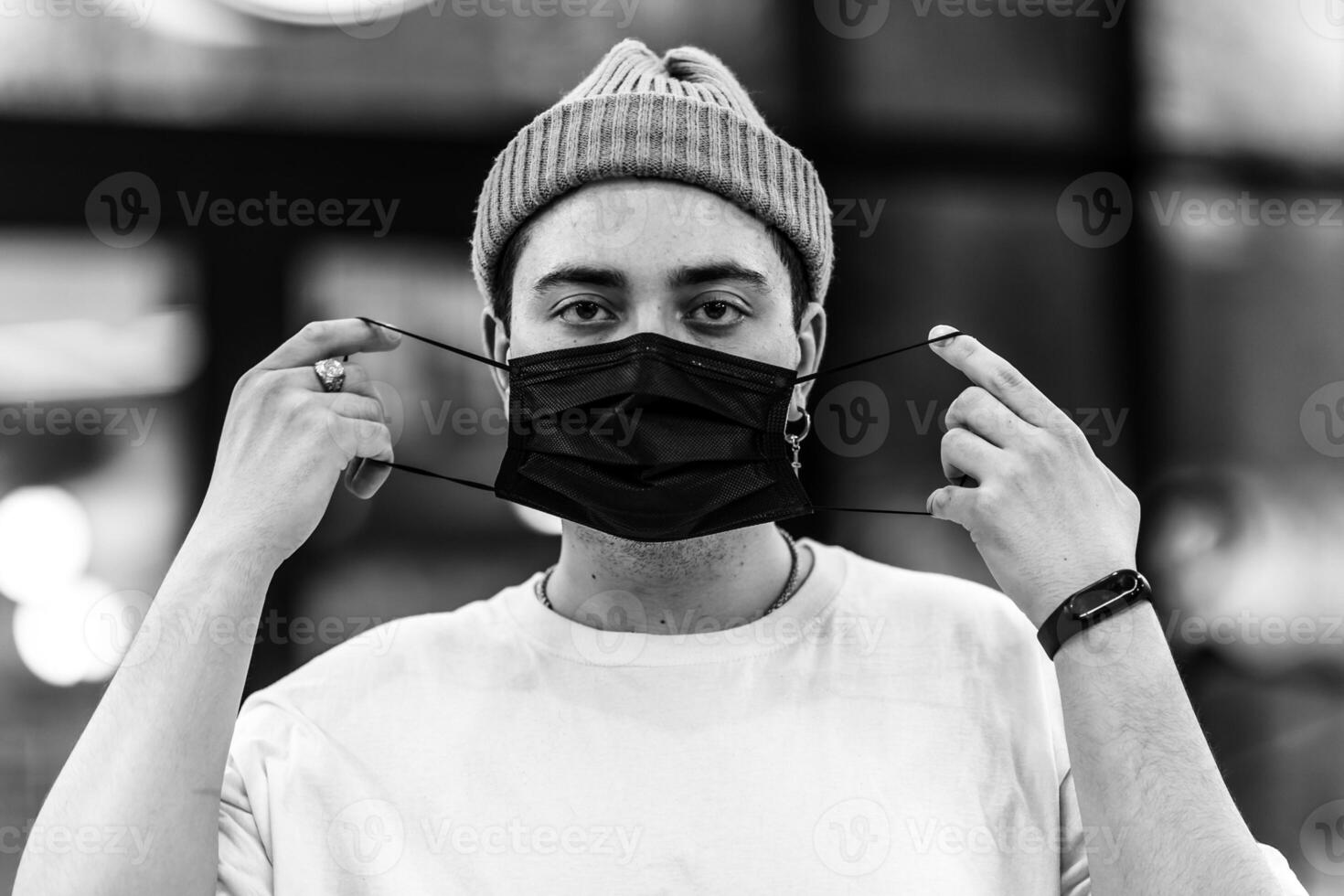 A man puts on a mask from a virus. Flu epidemic. photo