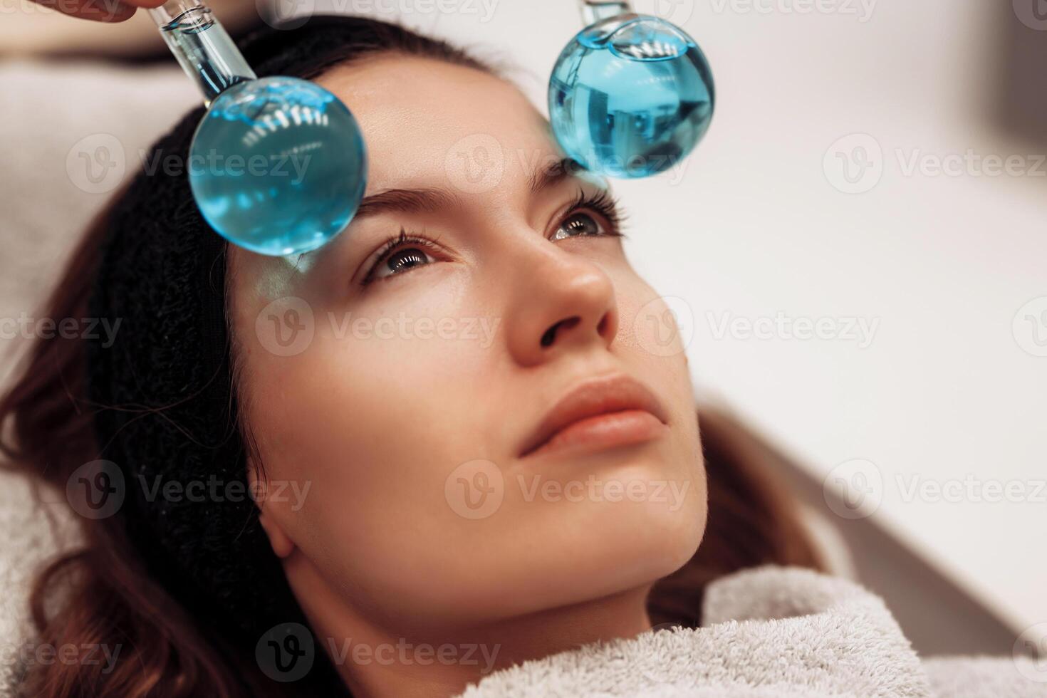 The woman is massaged face and body. photo