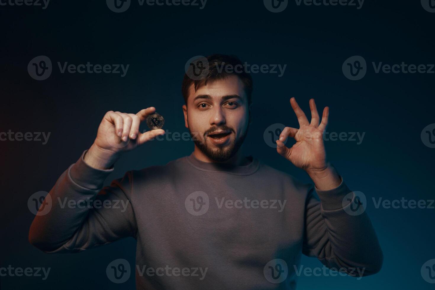Man holding bitcoin. Financial ecosystem. The currency of the future. photo