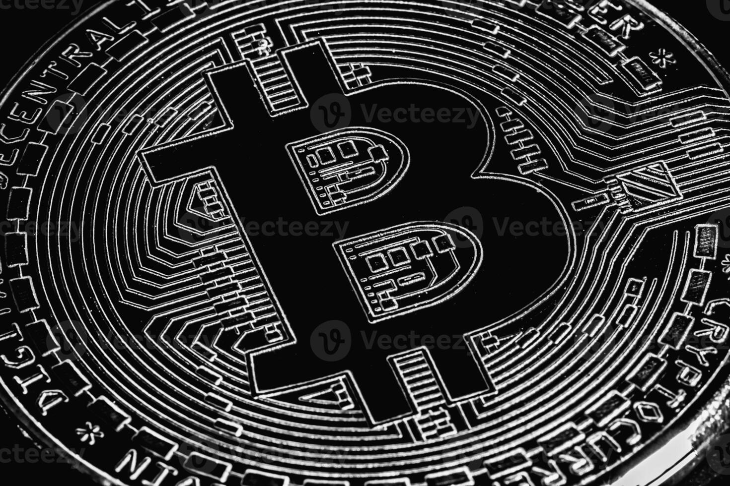 Bitcoin on black background. Cryptocurrency trading. Macro photo