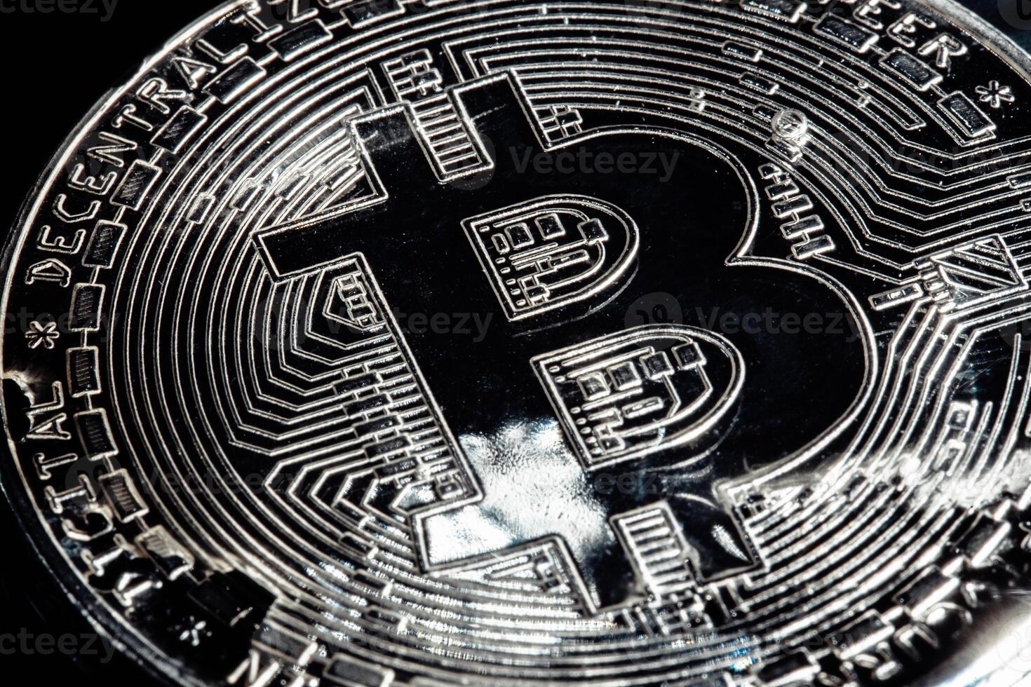 Bitcoin on black background. The world economic crisis. photo