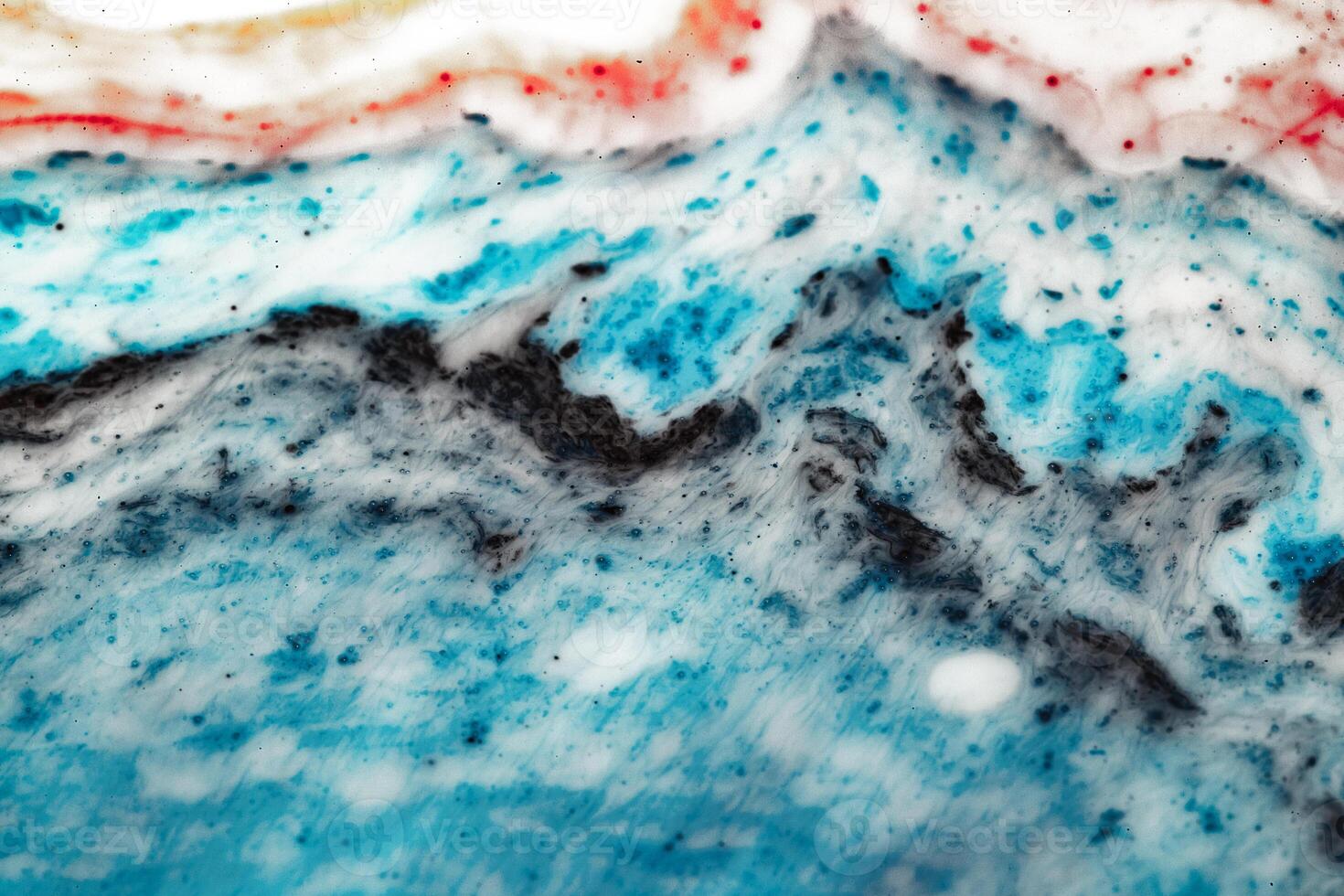 Macro world and texture of liquid with the addition of paint. photo