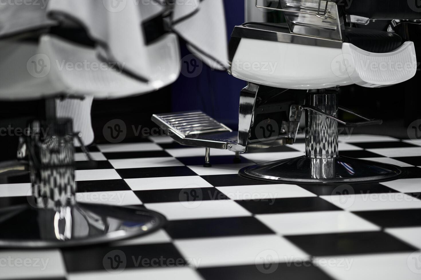 Stylish barbershop interior with modern design elements and checkered flooring photo
