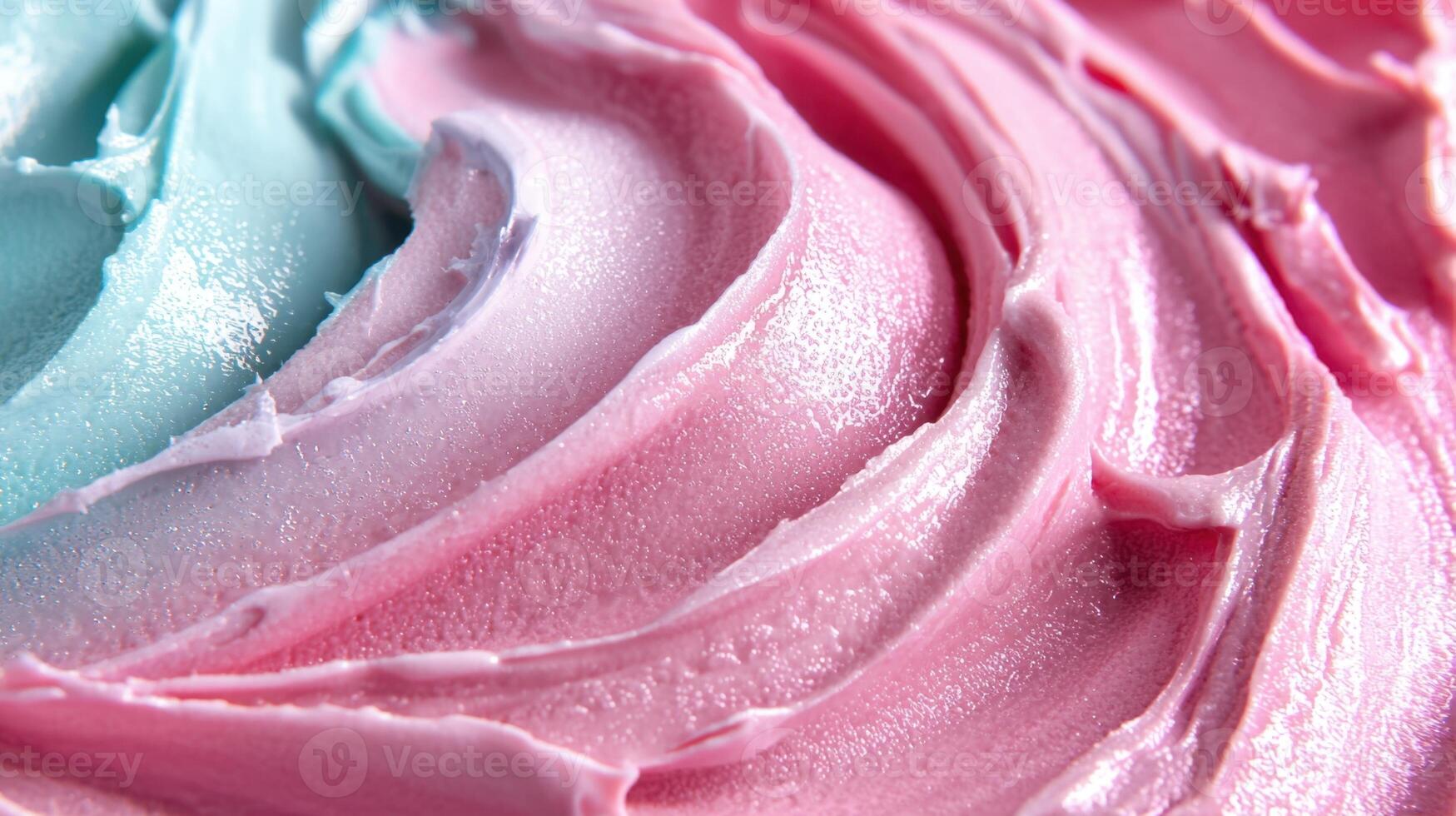 A close up of a pink and blue frosting photo
