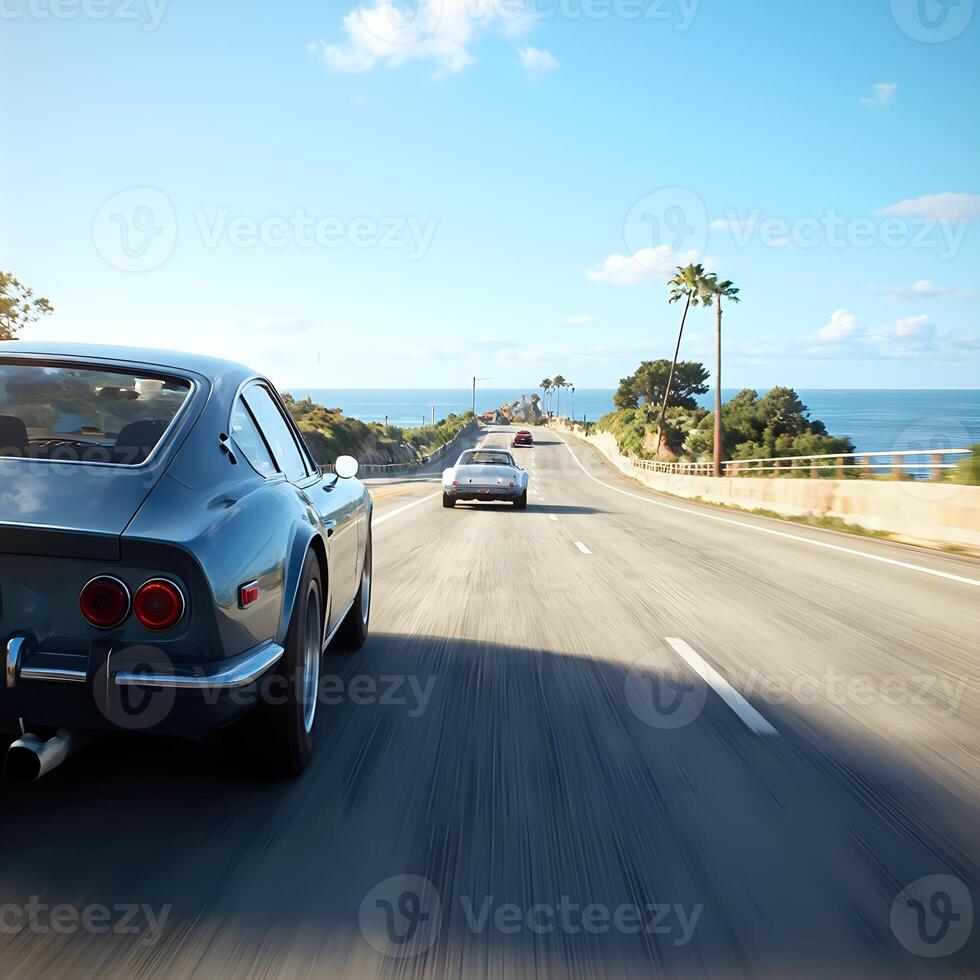 A car driving down the highway with the ocean in the background photo