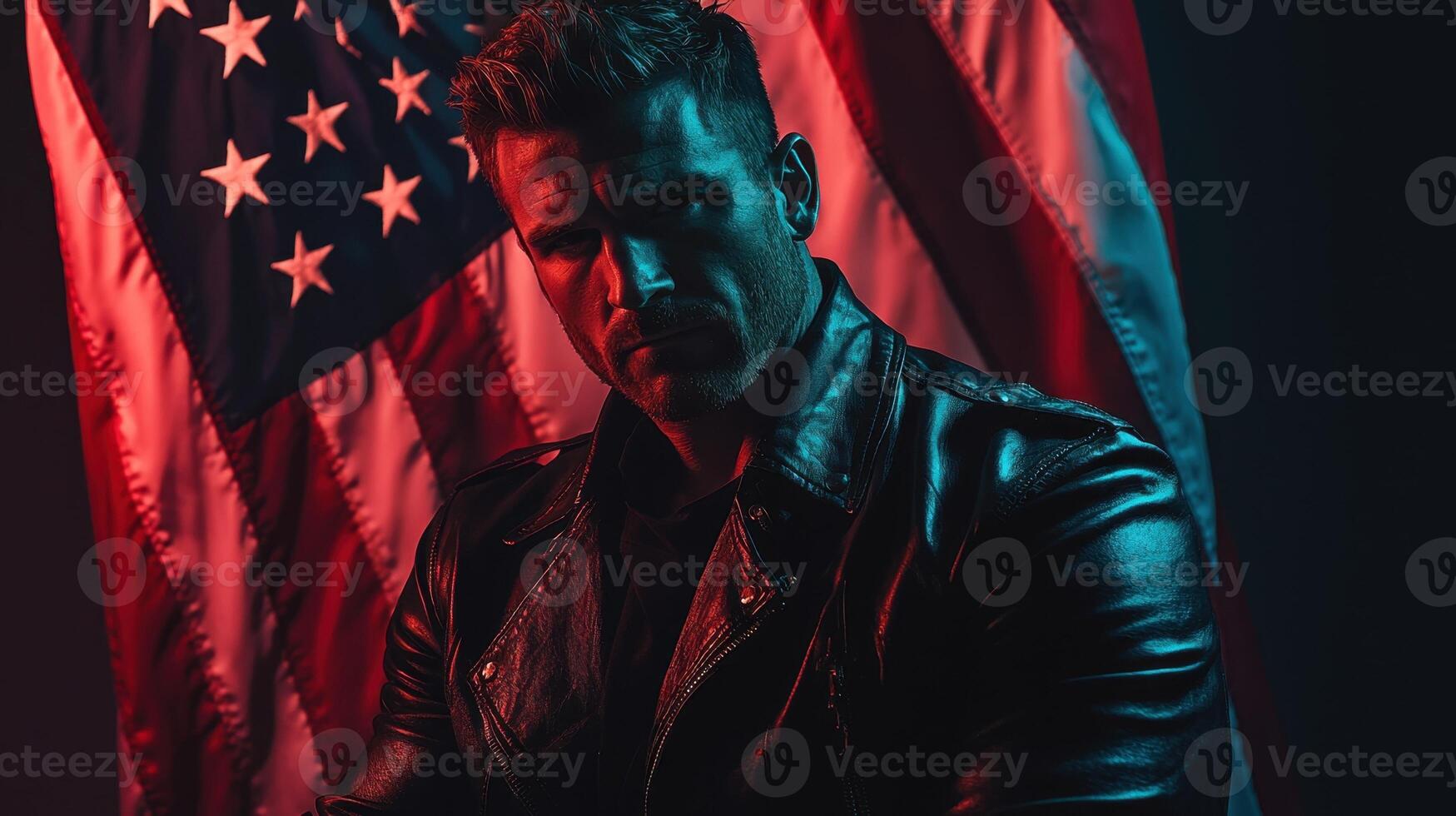 A man in leather jacket standing in front of an american flag photo