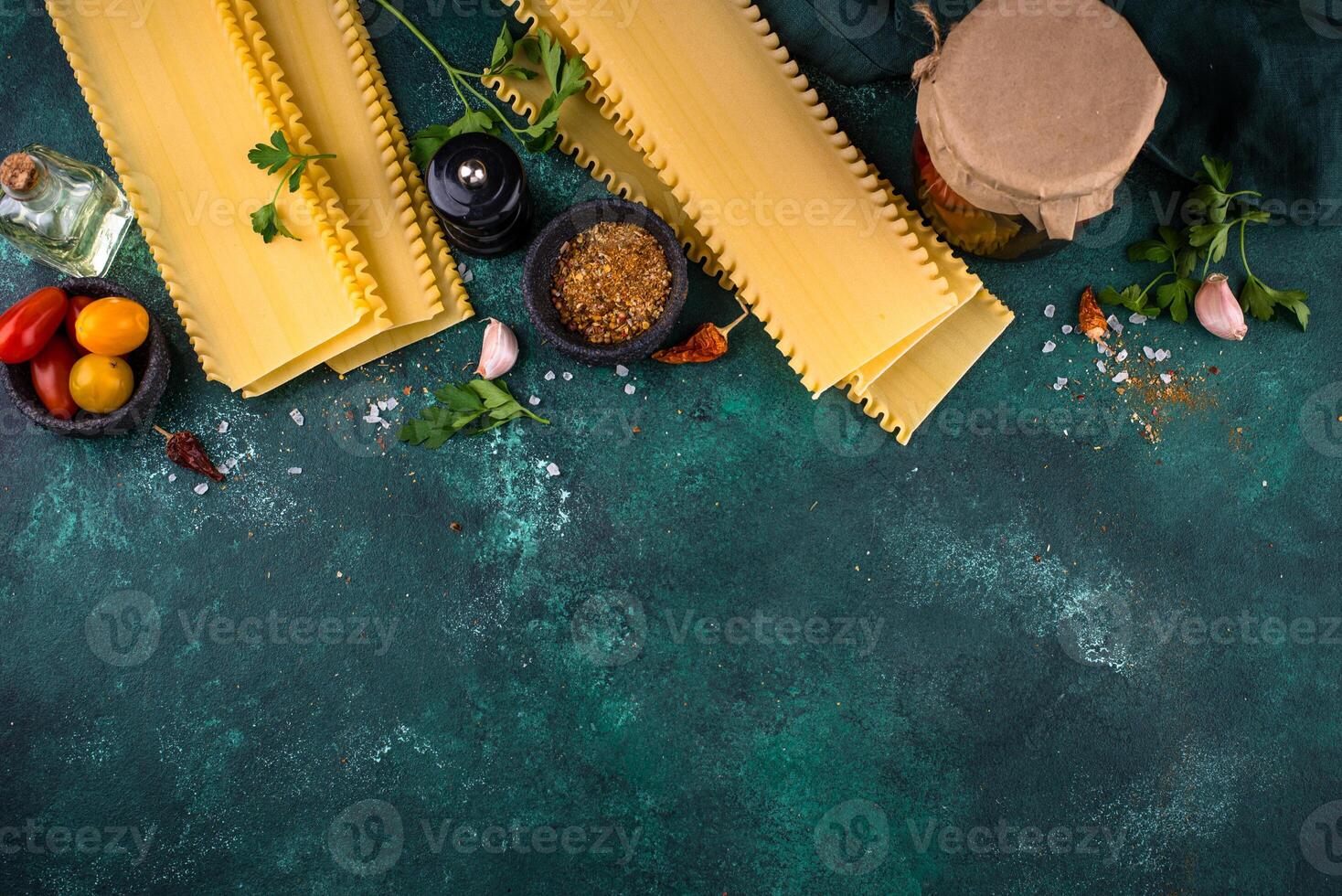 Uncooked lasagna pasta with cooking ingredient photo
