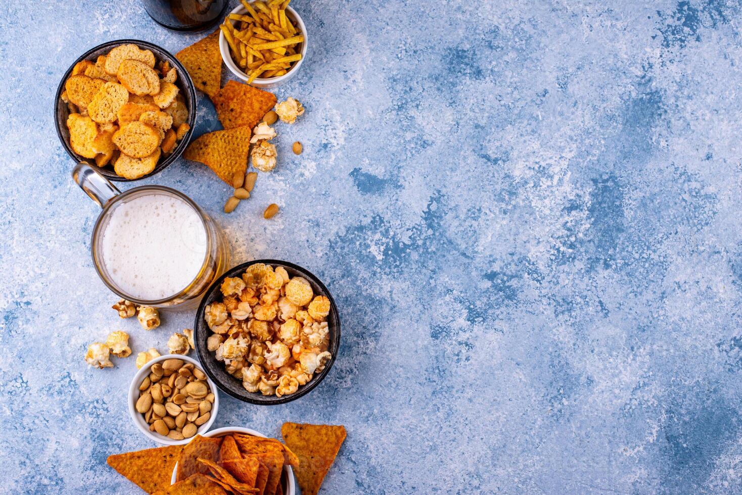 Beer and different snacks for Superbowl or football party photo