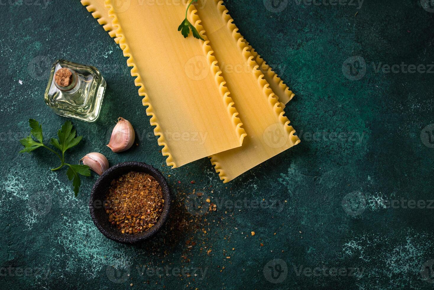 Uncooked lasagna pasta with cooking ingredient photo