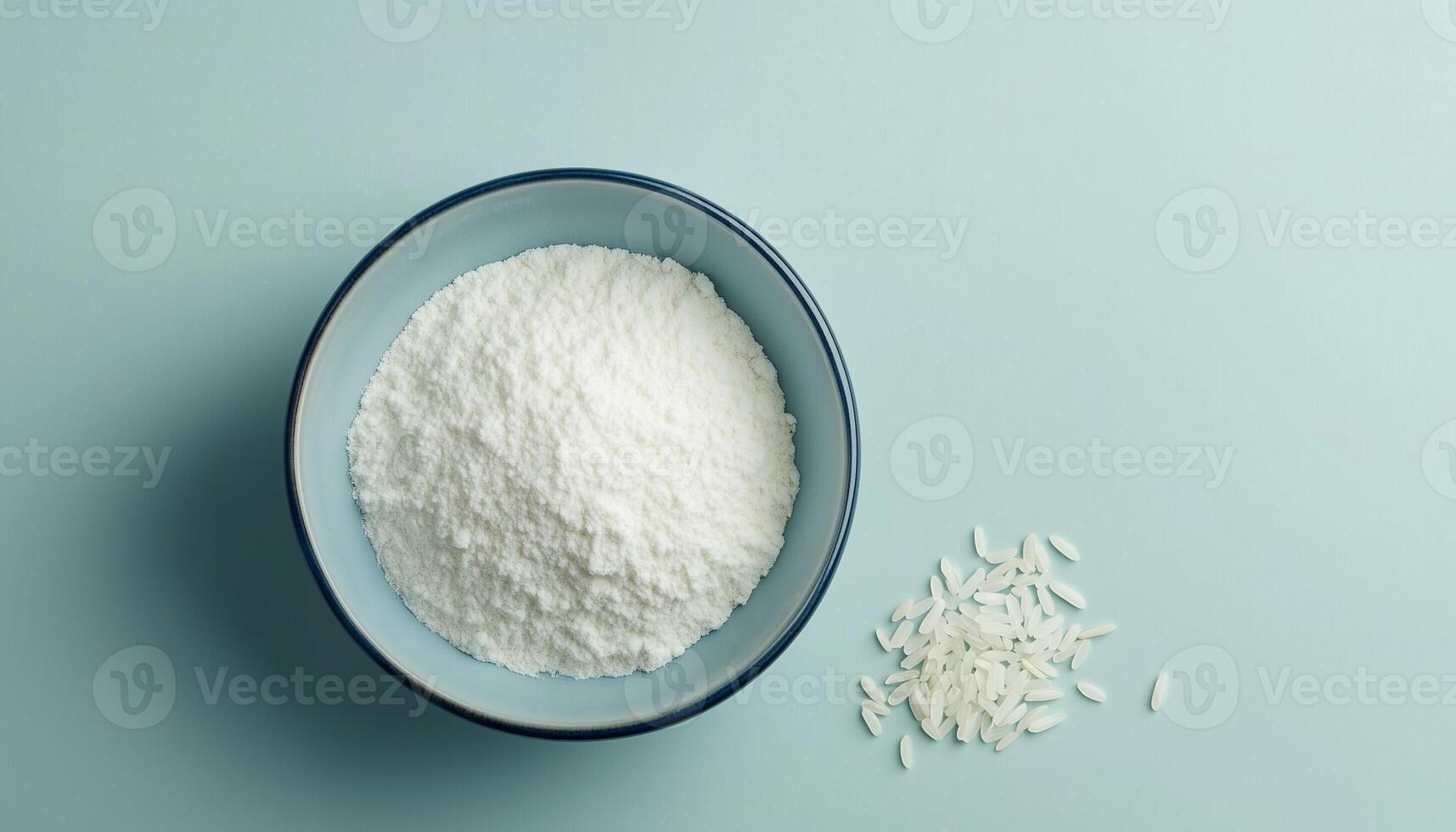 Rice flour gluten free on ceramic bowl in blue background photo