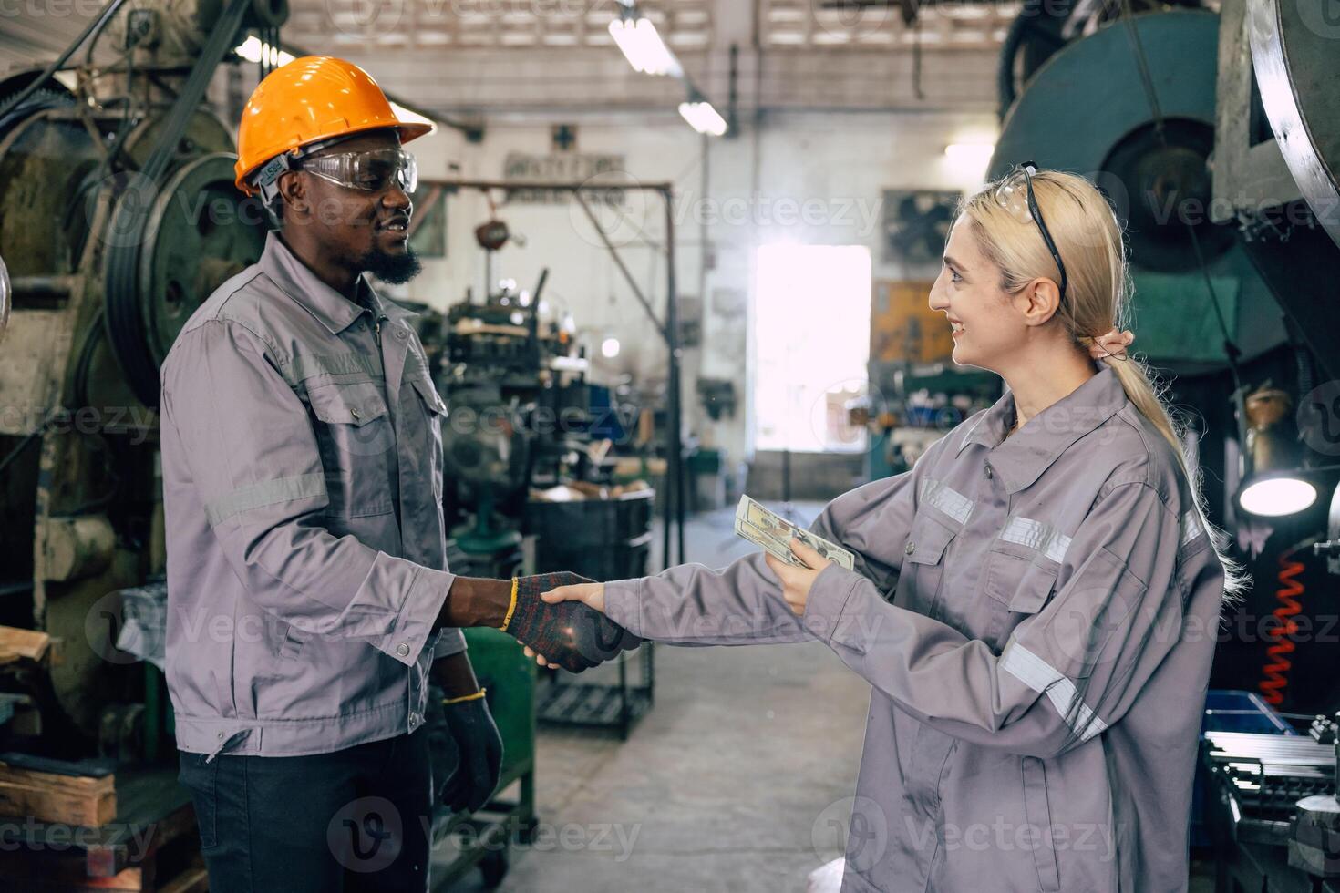 happy rich labor worker get paid salary enjoy with payroll money income from hard work in factory photo