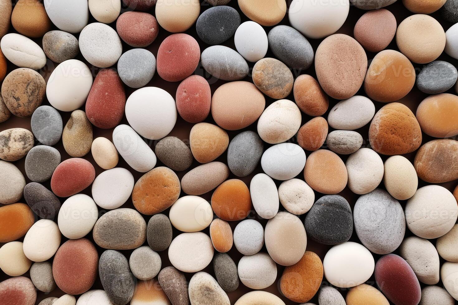 A large pile of pebbles with different colors photo
