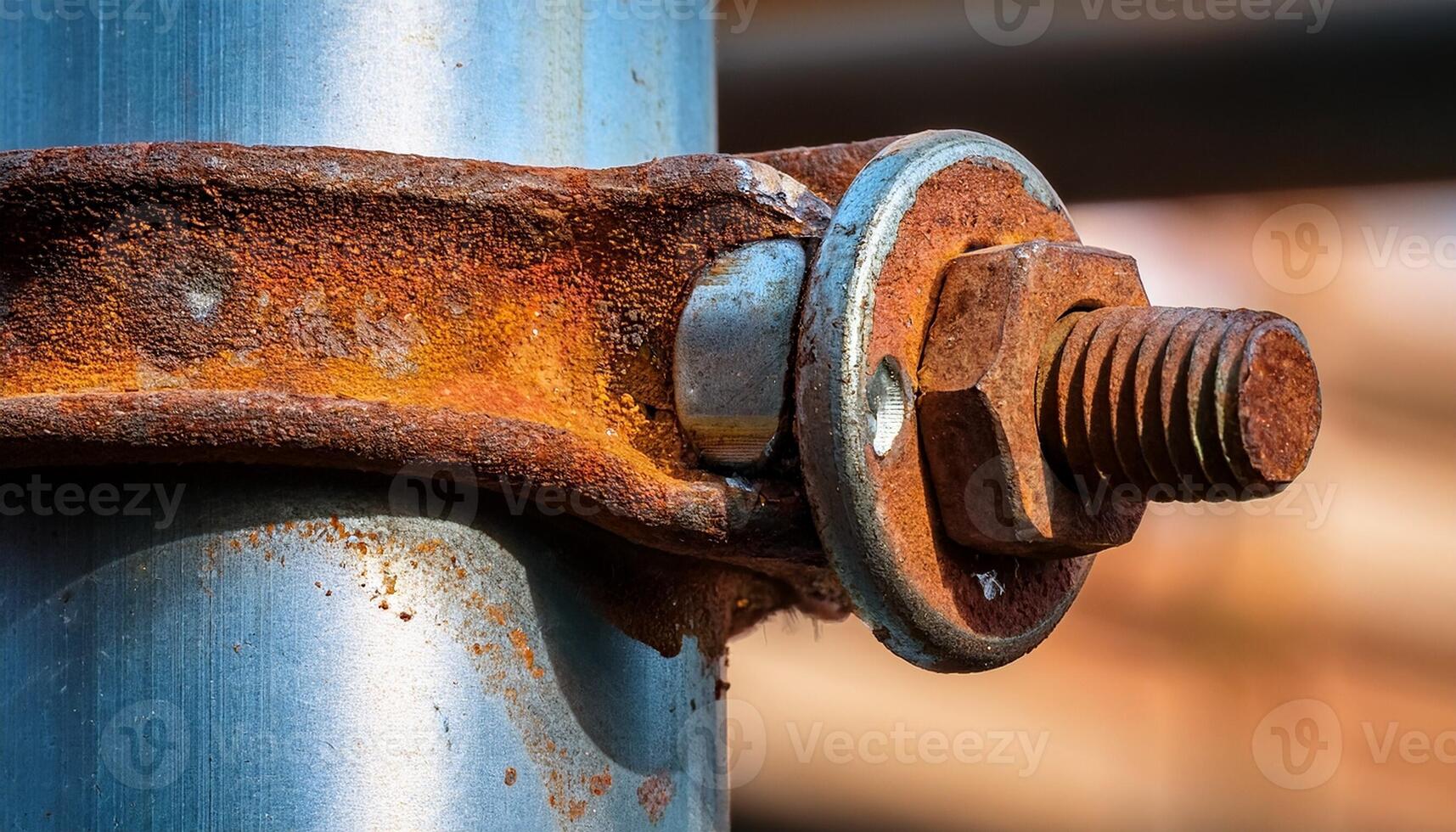 Rusty Bolt and Bracket Connection on a Steel Pole During Daylight in an Industrial Setting photo