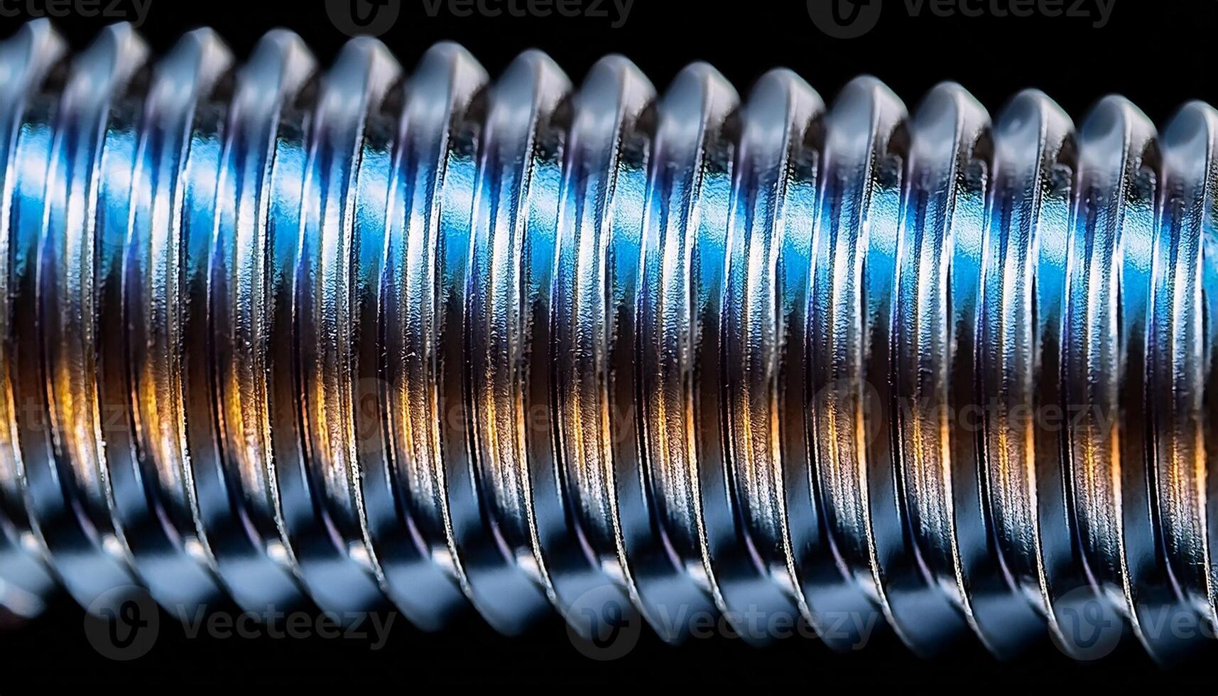 Close-up View of a Metallic Screw Showcasing Its Detailed Threading and Reflective Surface Under Bright Lighting photo