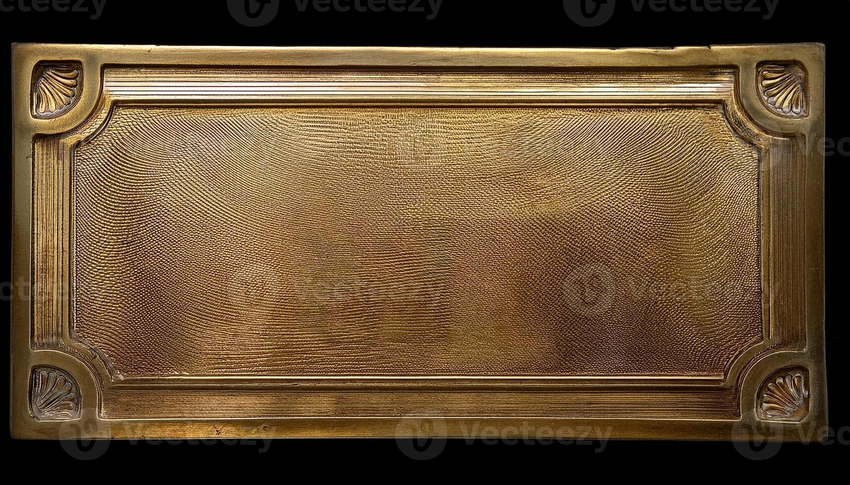 Fine Detailed Brass Plate Featuring Intricate Patterns Resting on a Dark Surface With Soft Lighting photo