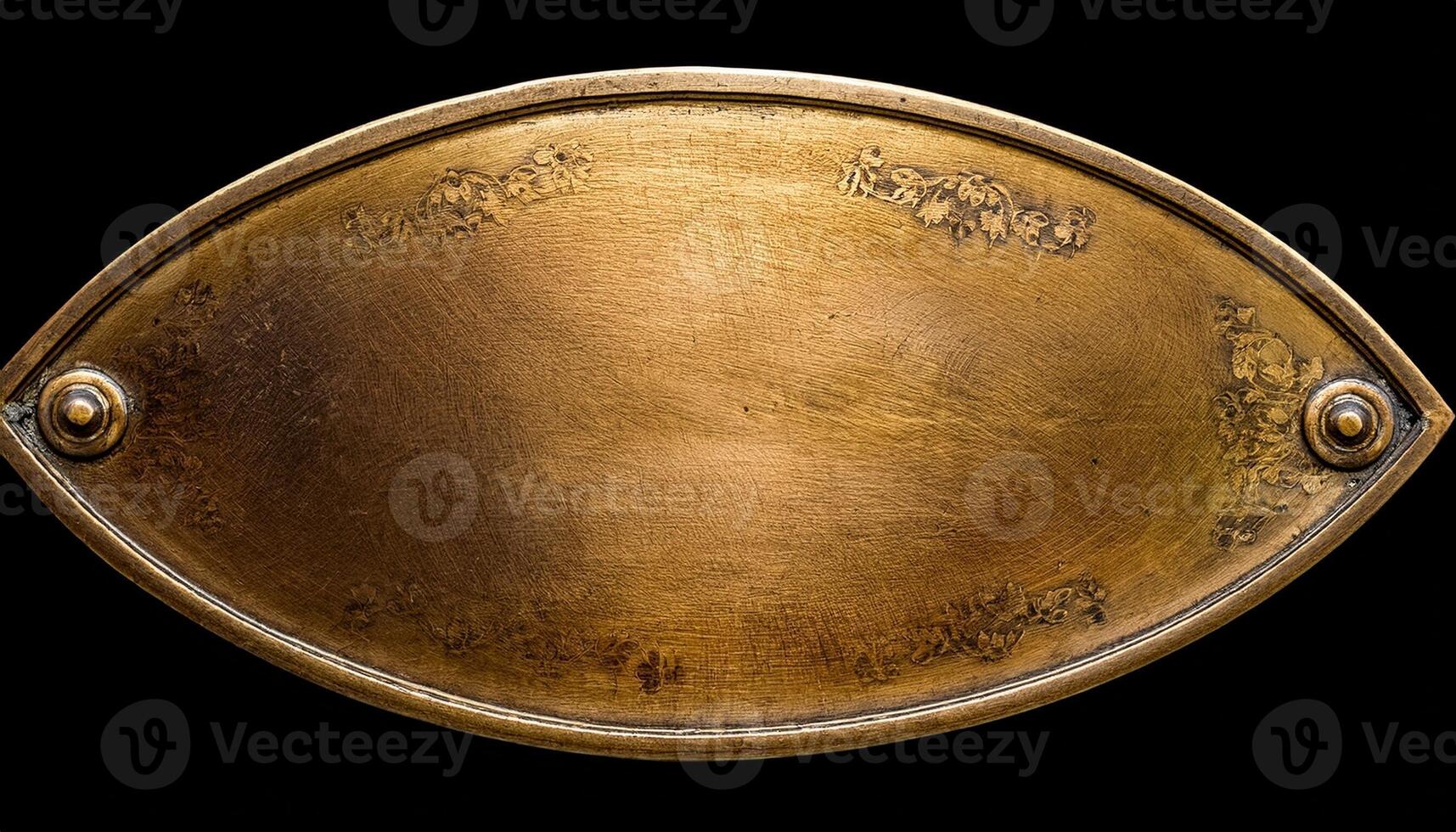 Vintage Brass Plaque With Intricate Designs Displayed Against a Dark Background photo