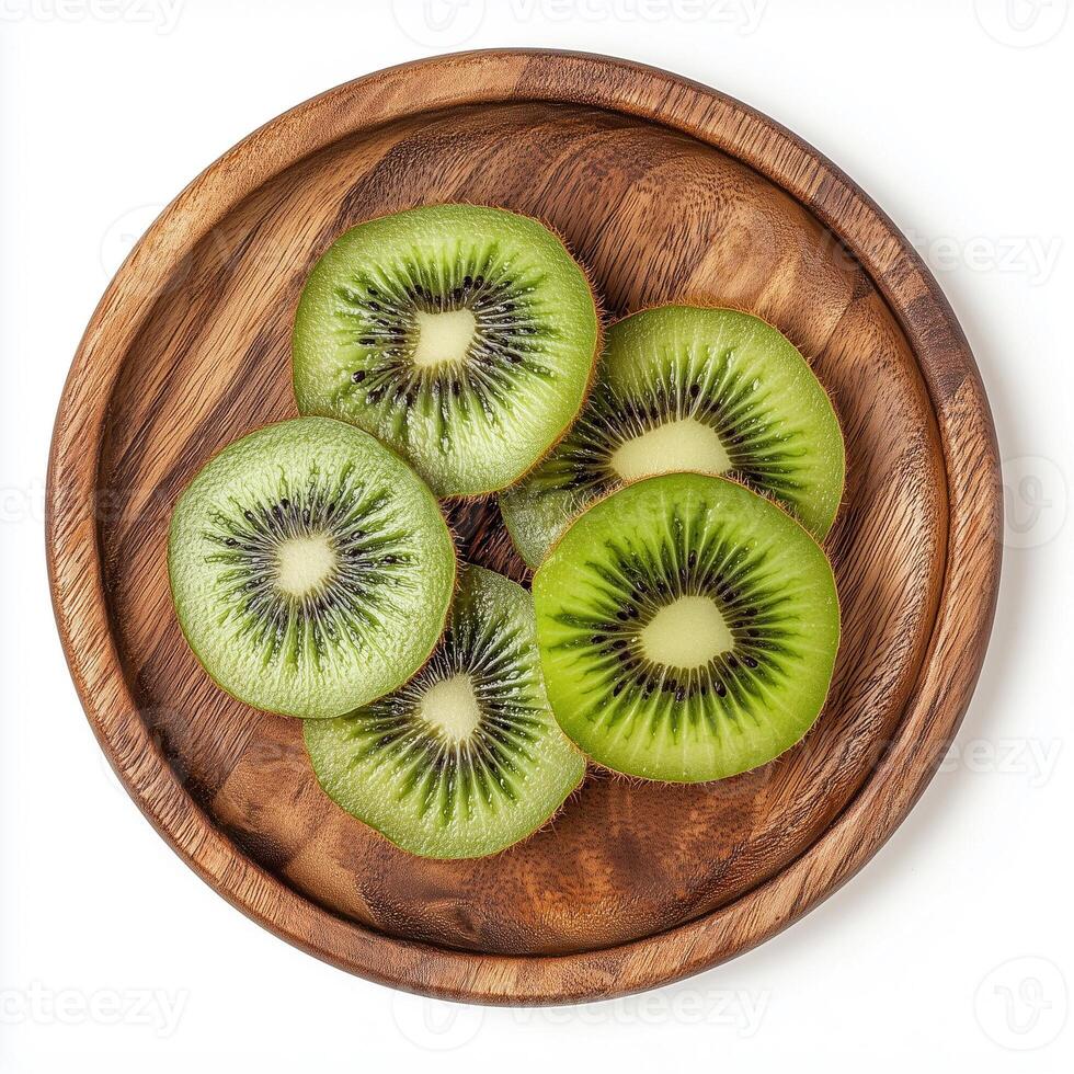 Freshly Sliced Kiwi Served on a Wooden Plate Showcasing Vibrant Green Colors and Unique Patterns photo