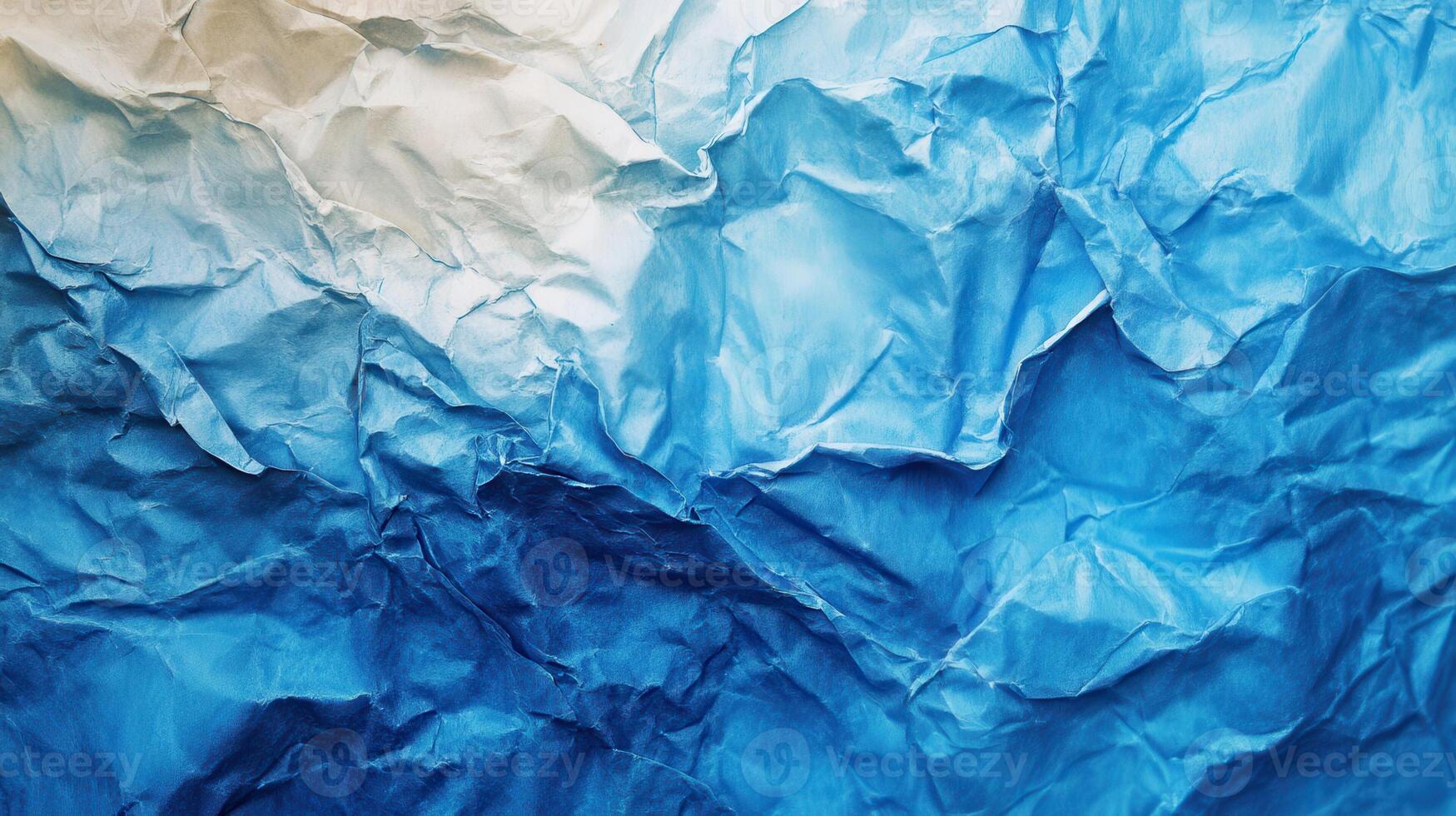 Crumpled paper background with blue and white crumpled paper photo