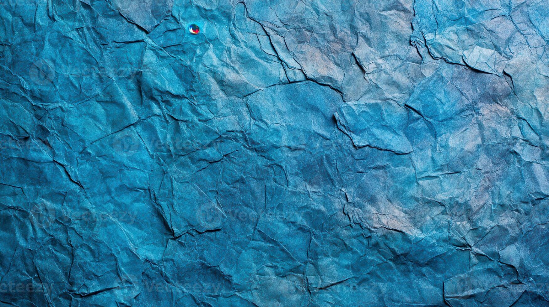 Crumpled paper texture background with blue color photo