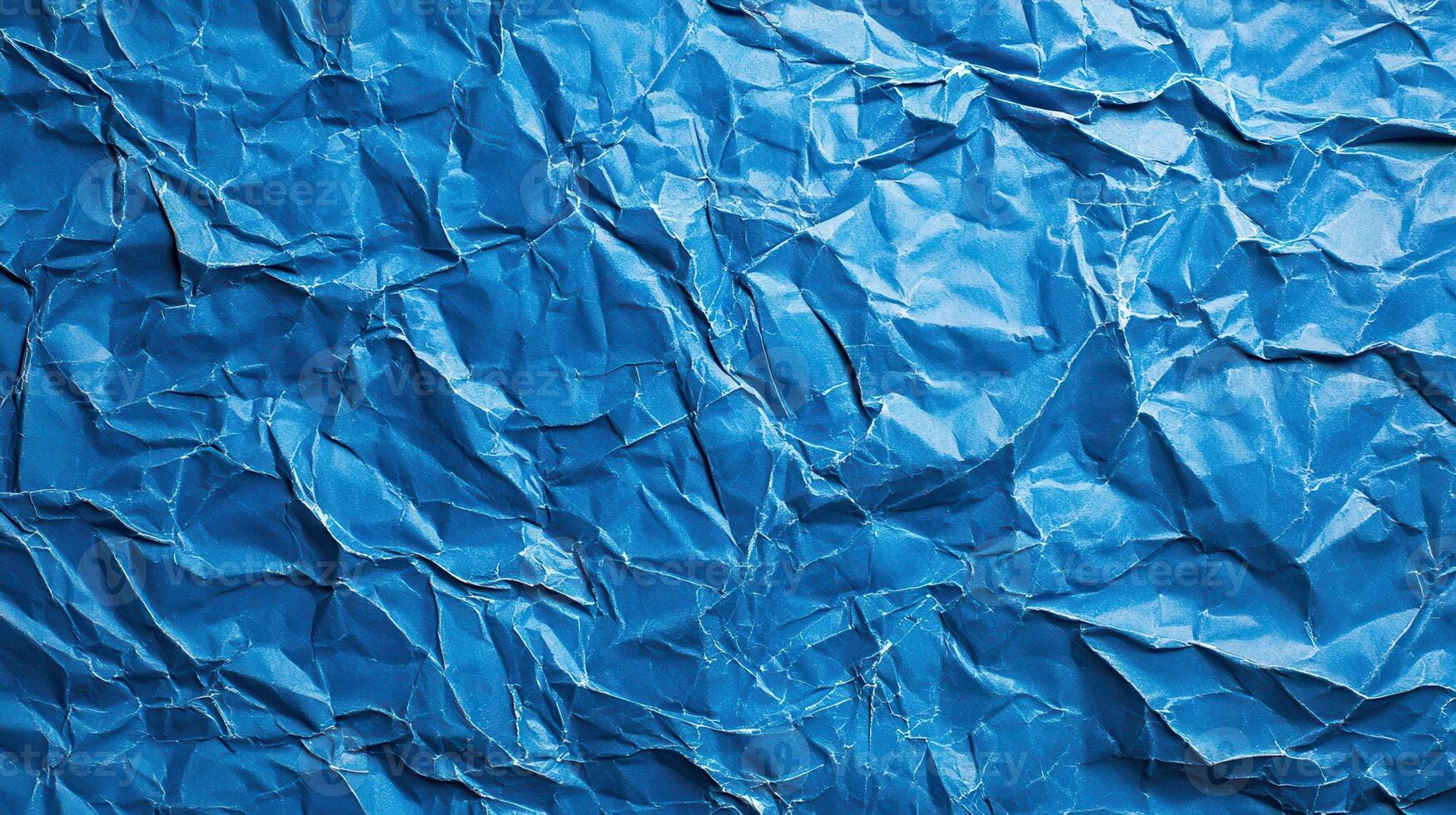 Crumpled blue paper background photo