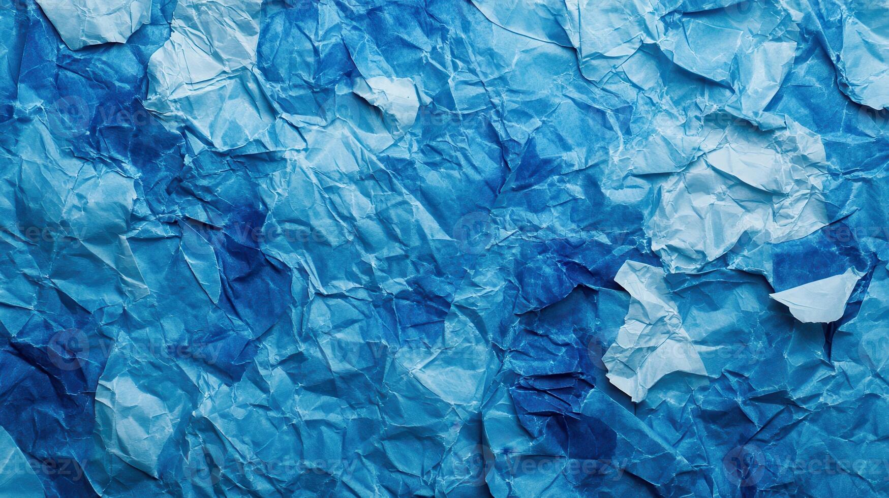 Crumpled paper background with blue crumpled paper photo