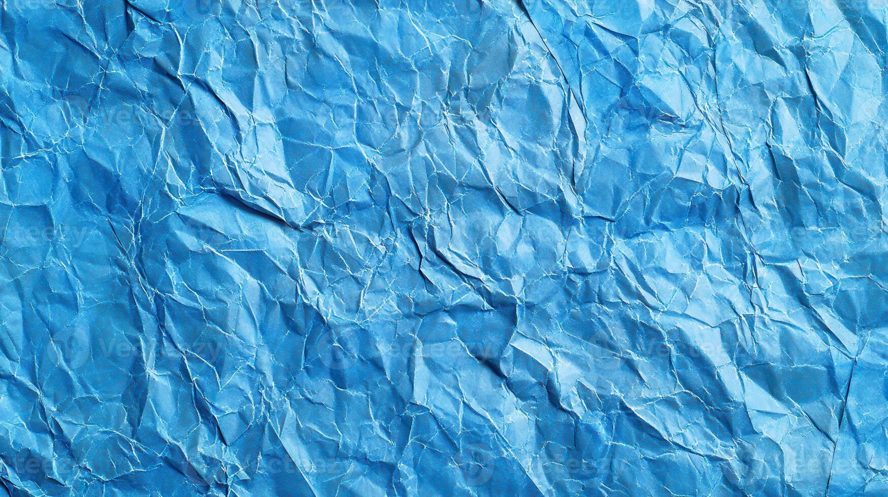 Crumpled blue paper texture background photo