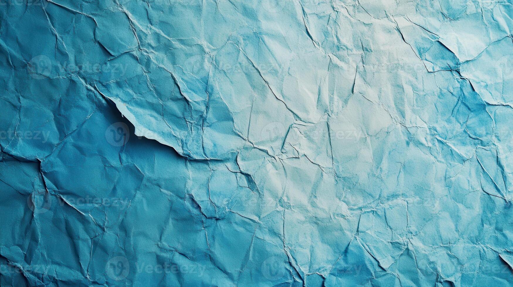 Crumpled paper background with blue color photo