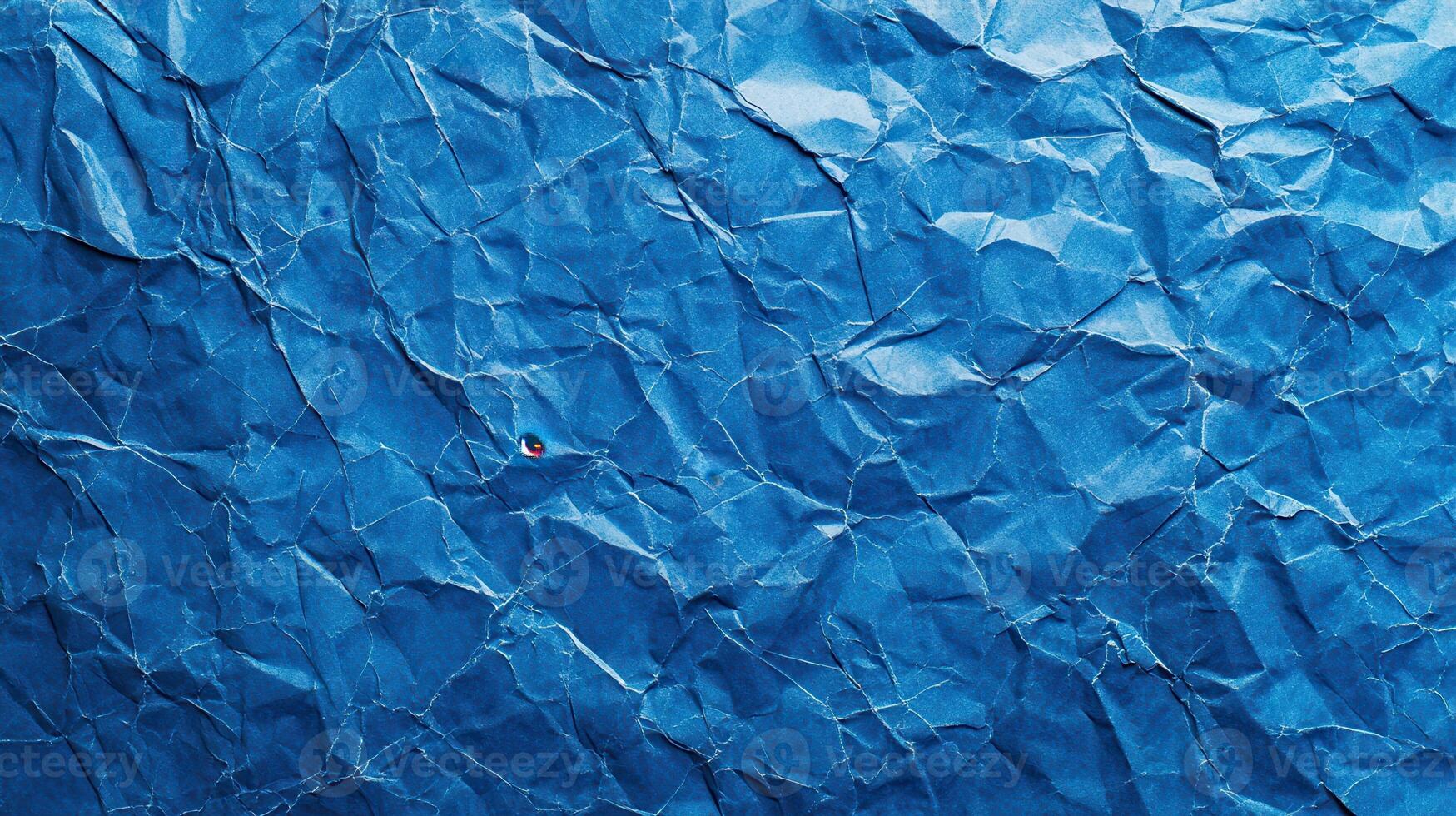 Crumpled blue paper texture background photo