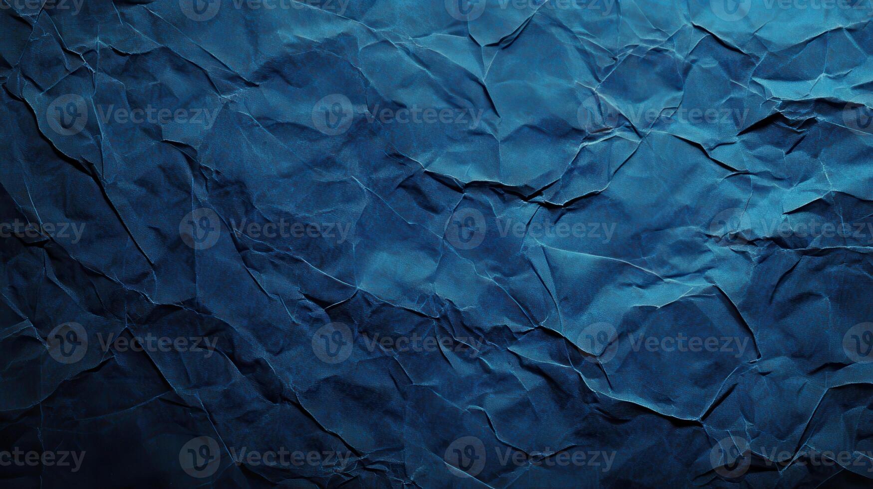 Crumpled paper background with dark blue color photo