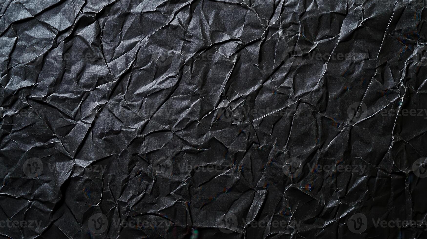 Black crumpled paper texture background photo