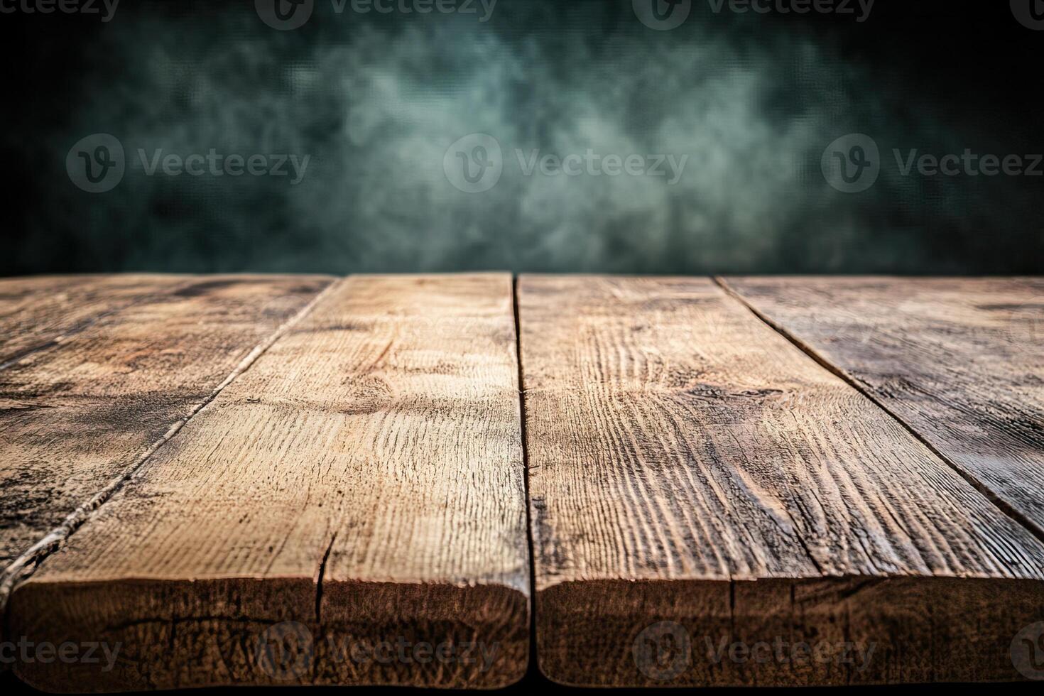 Wooden table with smoke and dark background photo