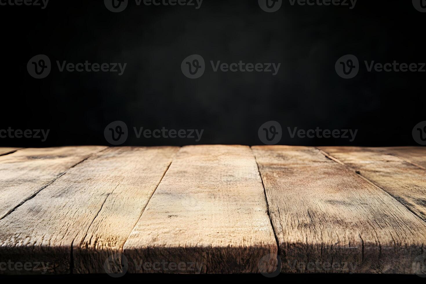 An empty wooden table with a black background photo