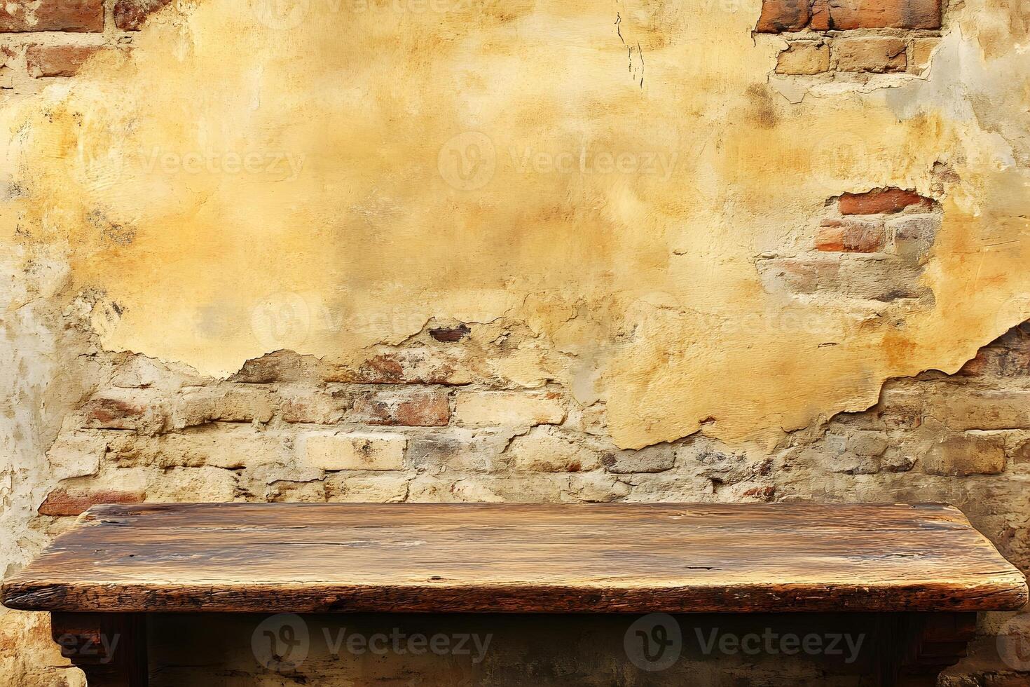 An old table sitting in front of a brick wall photo