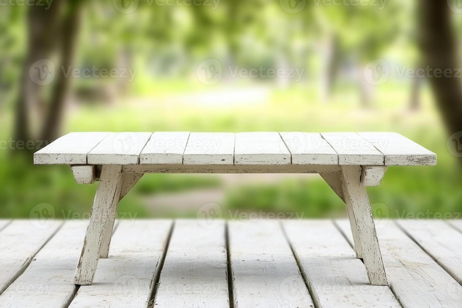 A rustic wooden table in a serene outdoor setting. photo