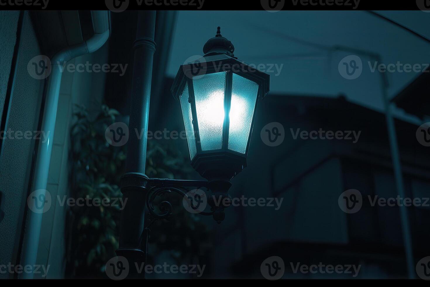 A vintage street lamp illuminating a quiet evening scene. photo