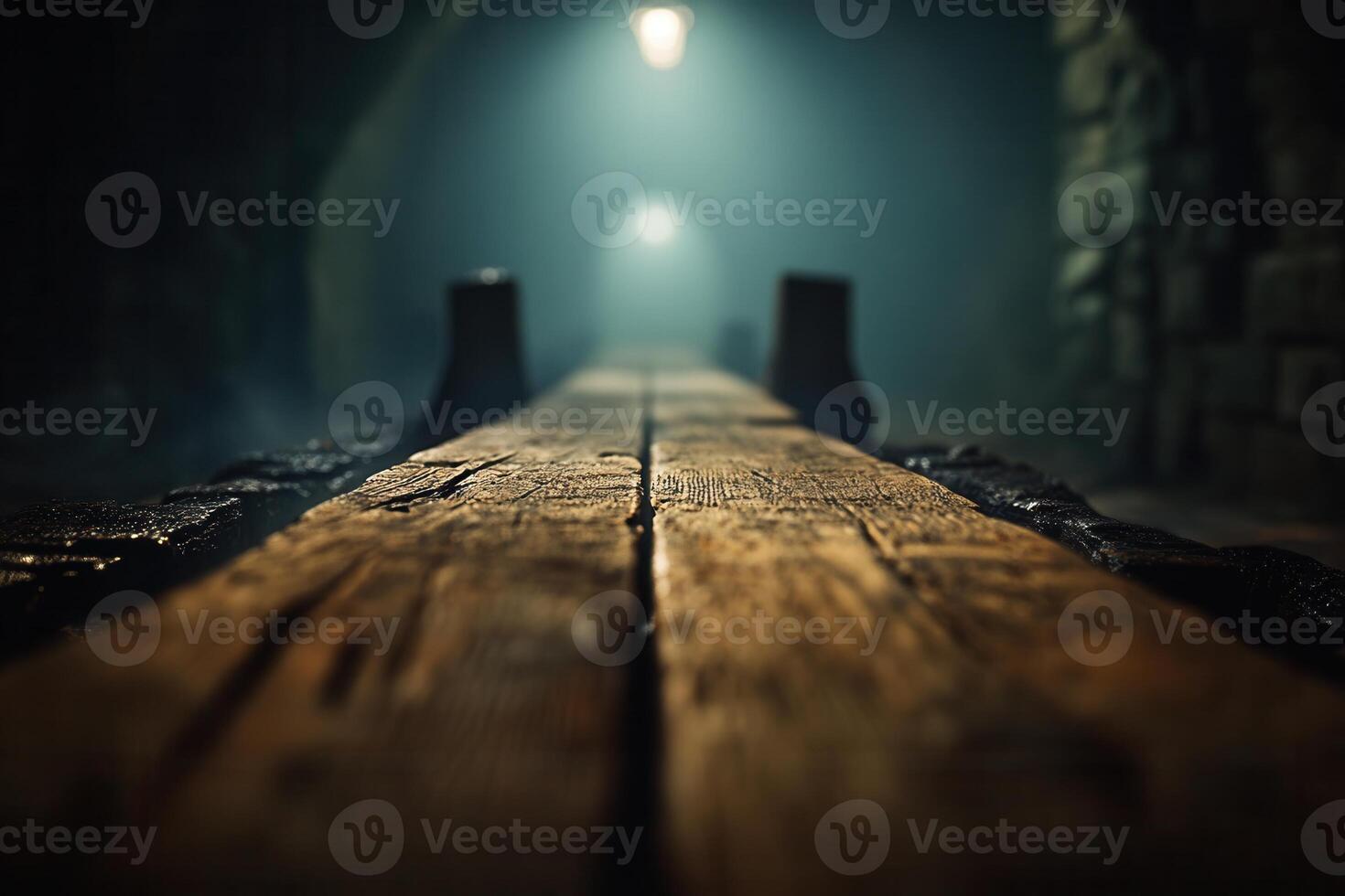 Dimly lit wooden pathway in an atmospheric setting. photo