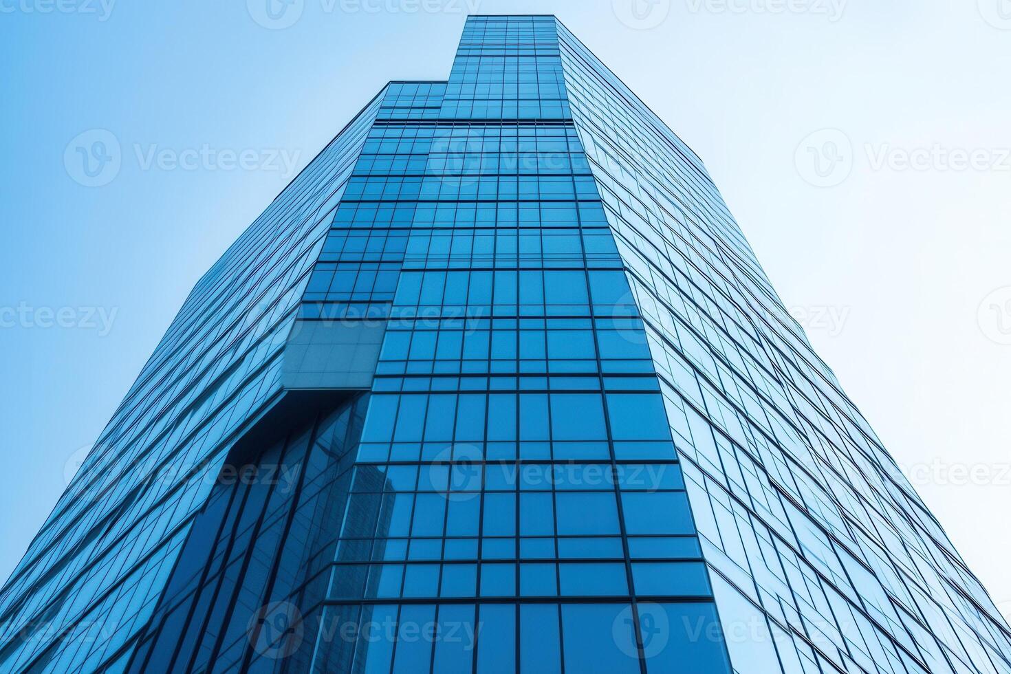 Modern skyscraper with reflective glass facade. photo