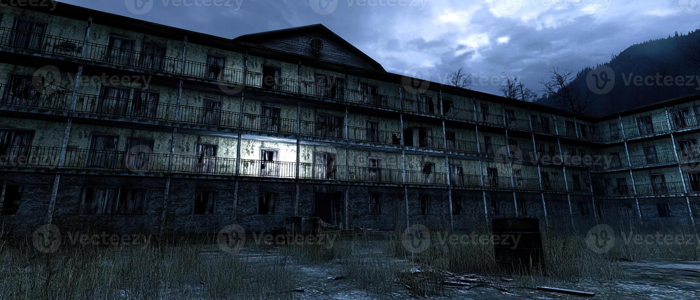Derelict building twilight, mountain backdrop photo