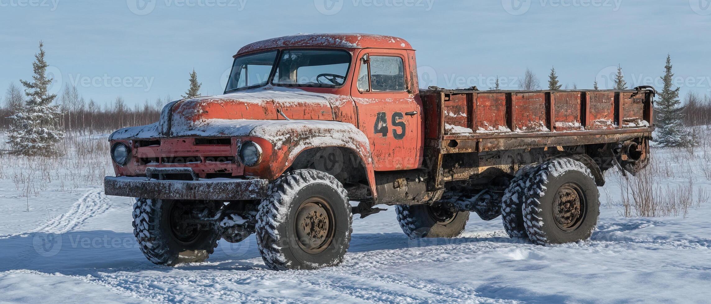 Rusty truck in snowy landscape photo