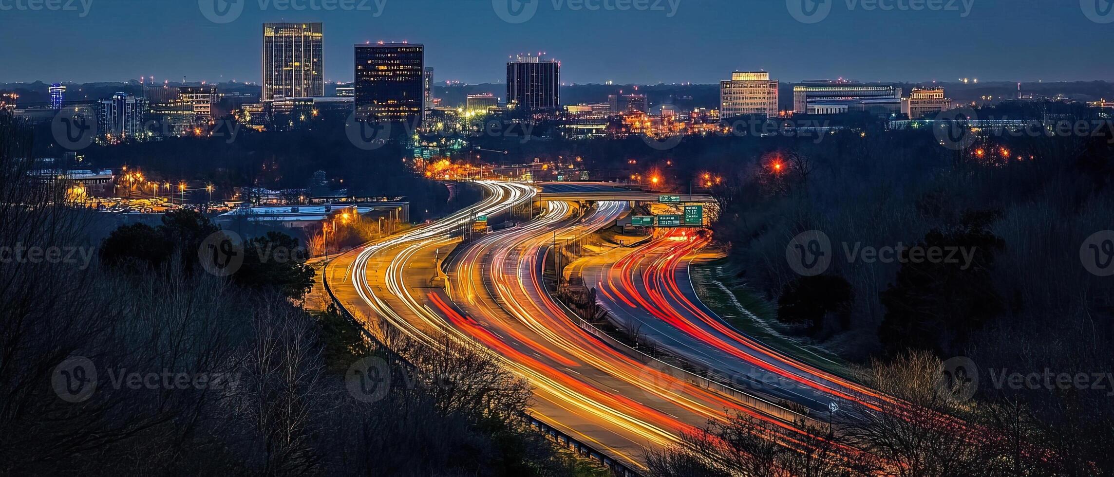 Night highway curves, city skyline backdrop photo
