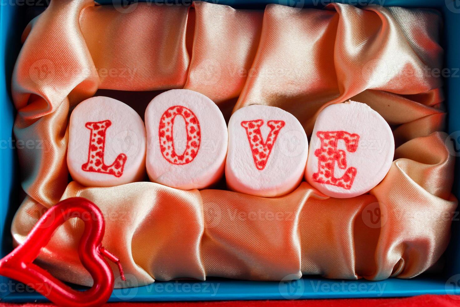 candies on golden background for valentine's day photo