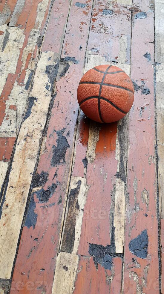 Vintage Basketball on Weathered Wooden Floor photo
