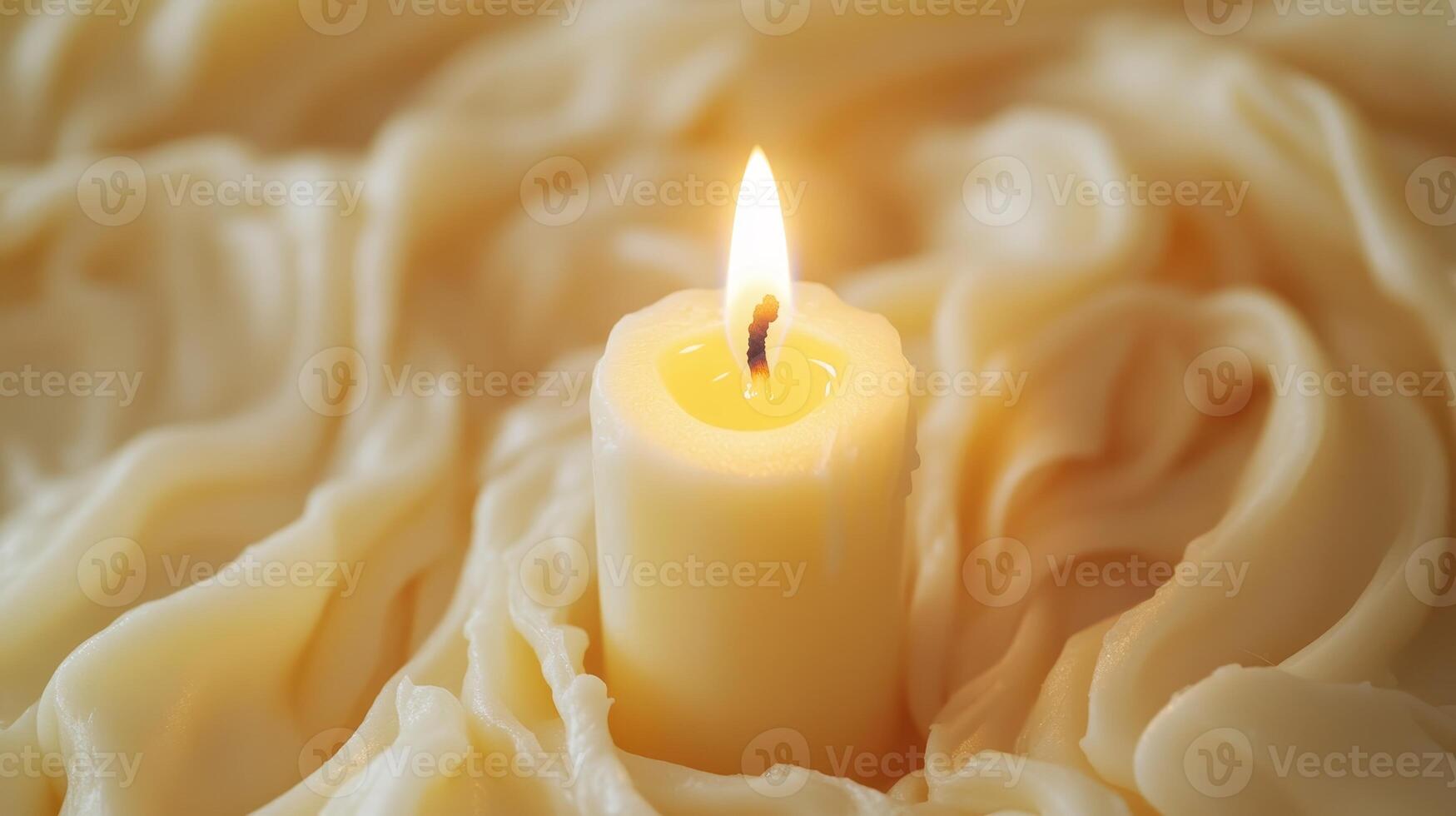 A Single Candle's Warm Glow in a Soft, Creamy Texture photo