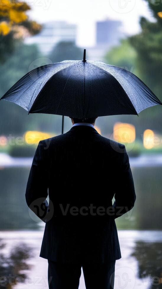 Rainy Day Reflection A Businessman's Contemplation photo