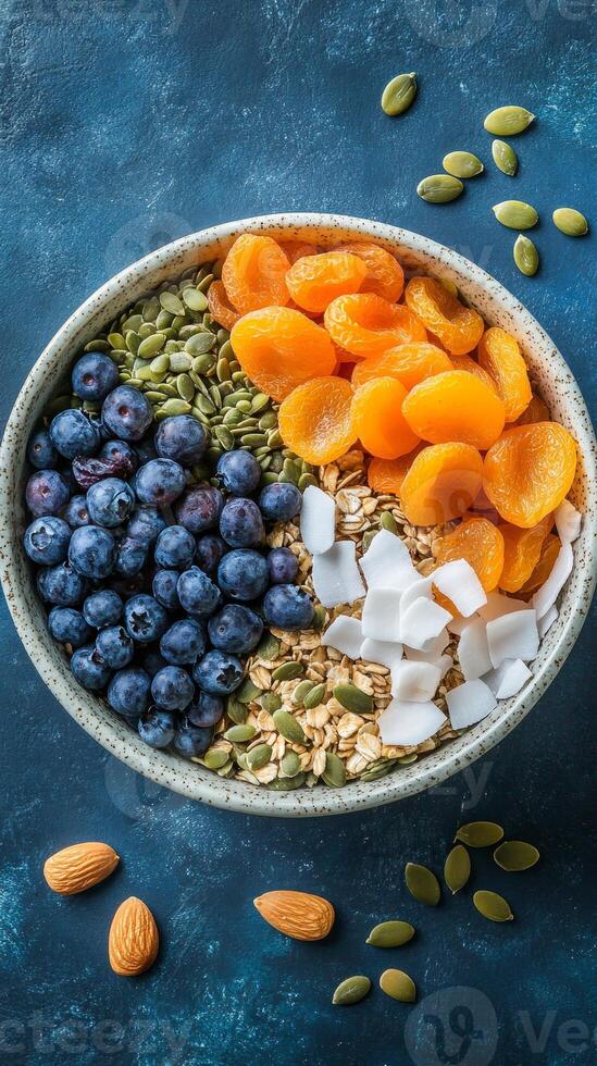 Healthy and Delicious Breakfast Bowl with Berries, Apricots, and Seeds photo