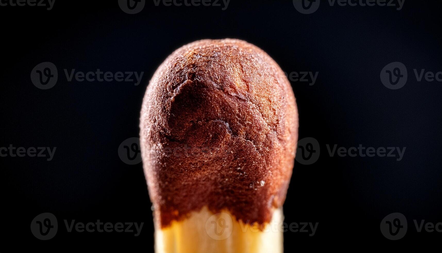 Close up of a Striking Matchstick Against a Dark Background Highlighting Its Texture and Details photo