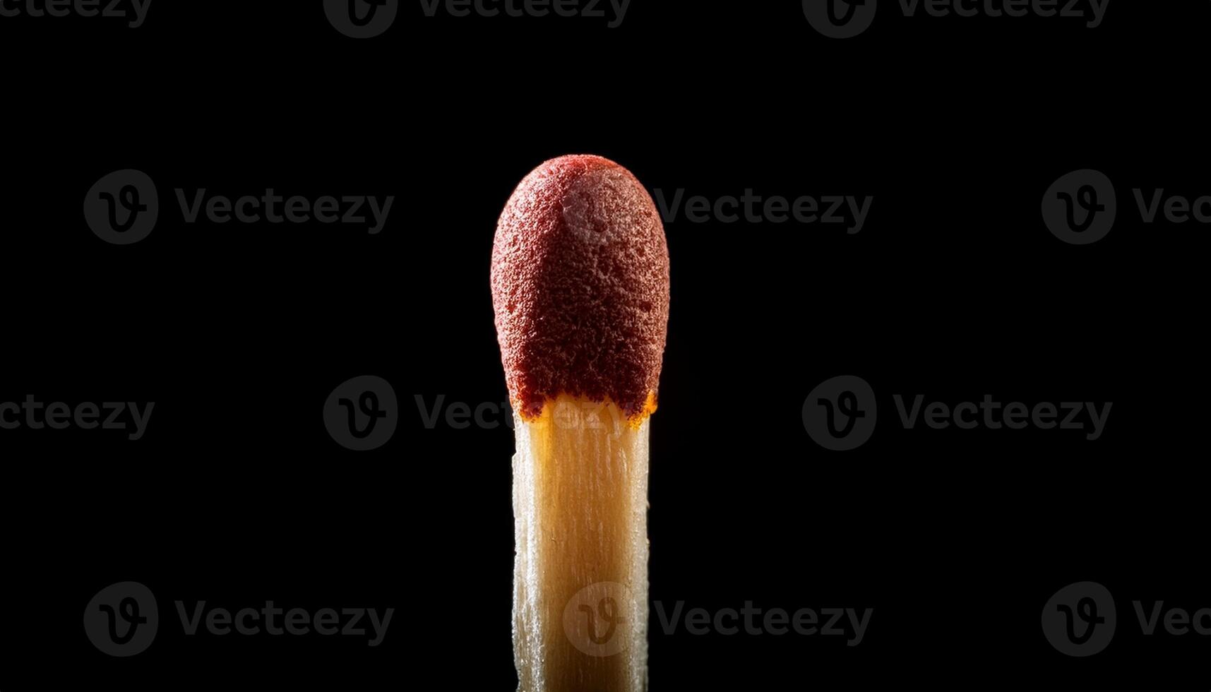 Close-up of a Matchstick Head Igniting Against a Dark Background, Highlighting the Spark of Potential Energy in Everyday Objects photo