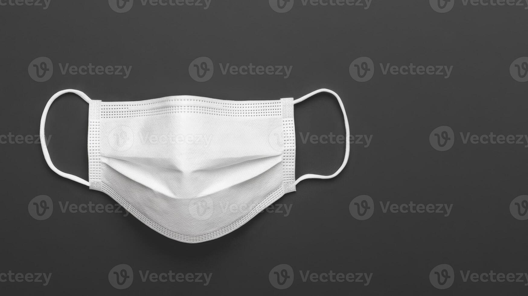 Protective White Mask on Black, Healthcare Concept photo